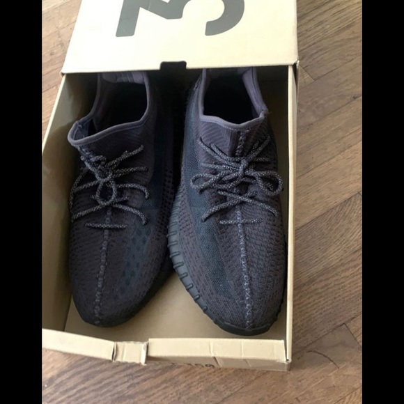 A pair of yeezys black 350size 14